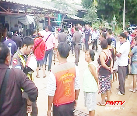 Neighbours surround the site of the murder and hanging.